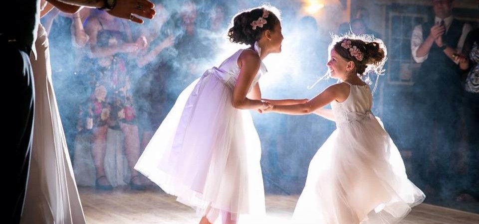 Children dance at a Timber House Resort wedding celebration.