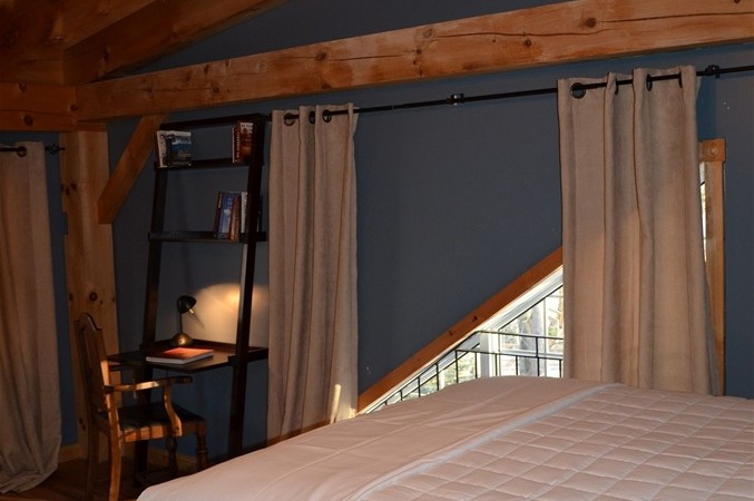 Spacious and comfortable, with a cathedral ceiling, overlooking woodlands.