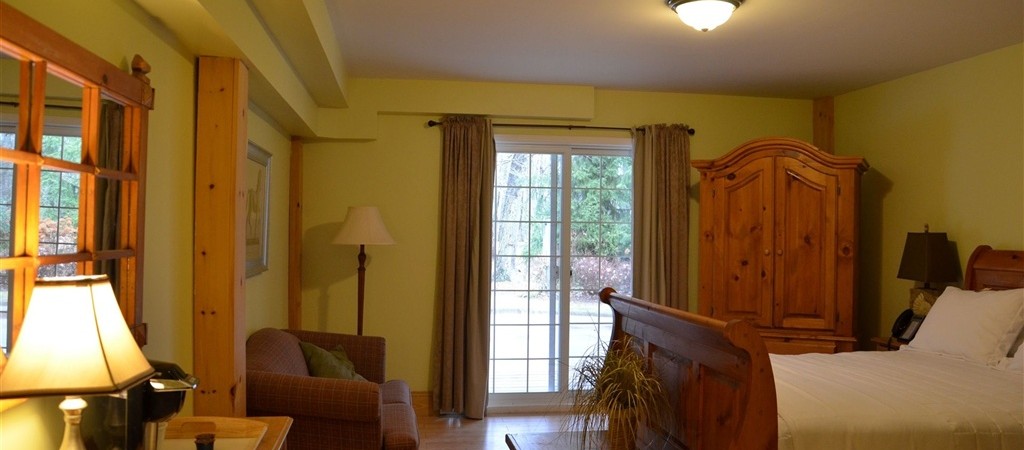 Large ground floor queen room with heated bathroom floor. Walkout to covered verandah.