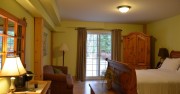 Large ground floor queen room with heated bathroom floor. Walkout to covered verandah.